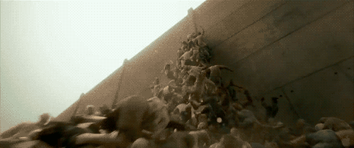 WWZ pile of people climbing wall, www.nerdatron.com, WWZ movie